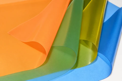 Orange, green and blue PVC sheets photographed together
